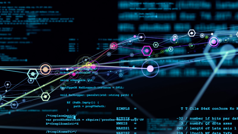 Stylised network graphic on a background of pseudo code